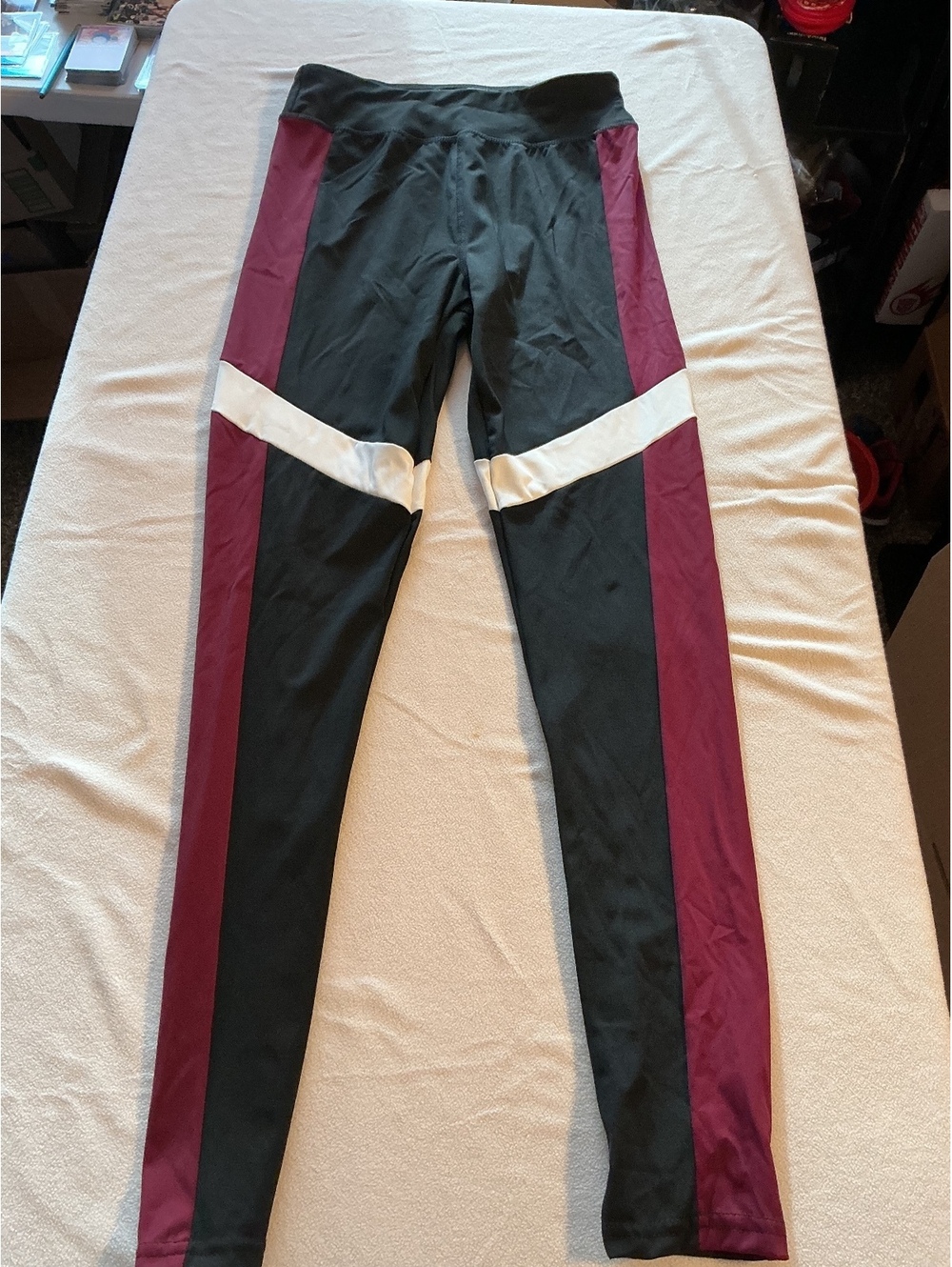 Forever 21 black leggings with burgundy side panels and white knee detail